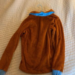 Cotopaxi Women’s burnt orange and light blue fleece